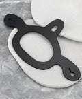 Rubber Spur Straps Tie Down Set, 4 Pcs on textured background for training horses, black rubber material