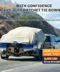 Car towing a boat secured with Boat Trailer Transom Tie Down Straps, Heavy Duty 1 Inch By 4 Feet, Retractable Ratchet Straps