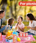 Family enjoying a picnic with Flat Bottom Popcorn Bags 50 Pack With Individual Servings For Movie Night, Parties, Carnivals, And Halloween.