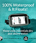 100 Percent Waterproof Fanny Pack For Beach And Travel floating in water with phone inside, showcasing airtight zipper and IP67 submersible feature.