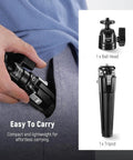 Person holding Go-To Mini Metal Table Tripod with 360 Degree Ball Head, compact and portable for travel, supports vertical recording.