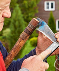 Person sharpening an axe using a Folding Pocket Diamond Sharpener For Garden Tools And Knives, Dual Sided 400 600 Grit Stone.