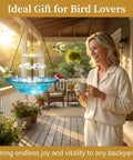 Sun Powered Hanging Bird Bath Fountain With Cascade Water Feature For Outdoor Garden Patio Backyard Lawn Decor Blue No Wiring Needed Easy Setup And Water Motion To Attract Birds And Elevate Your Outdoor Space installed on a porch.