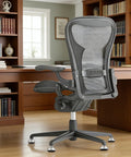 Ditch Those Dang Office Chair Casters With This 5 Pack Of Low Profile Bell Glides on an ergonomic office chair in a home office.