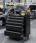 Rolling Tool Chest With 5 Drawers On Wheels, Portable Tool Cabinet With Locking System And Drawer Liners, Heavy Duty Tool Storage Cart For Garage And Workshop, Black in a workshop setting with cars in the background.