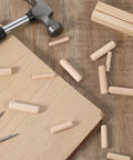 Thirty Piece Wood Dowel Set With One Quarter Inch, Three Eighths Inch, And Five Sixteenths Inch Hardwood Fluted Dowels on table