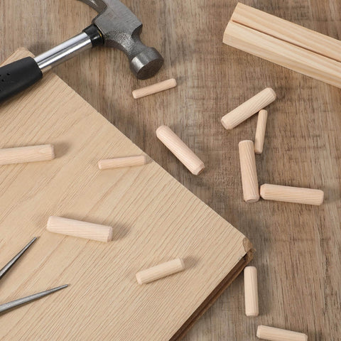 Thirty Piece Wood Dowel Set With One Quarter Inch, Three Eighths Inch, And Five Sixteenths Inch Hardwood Fluted Dowels on table