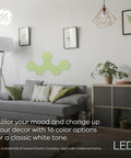 Living room with Color Changing LED Hexagon Tile Panels With Remote No App Or WiFi Needed Dorm Room Decor 6 Pack on wall.
