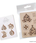 Four In One Wooden Puzzle Kit With Self Assembly Mini Mechanical Models Set Including Stocking Stuffer, Christmas Tree, Clock, And Bauble For Stress Relief, 3D Puzzles Fun For Ages 5 To 80, Plywood Construction. Plywood sheet with Christmas tree, clock, and stocking pieces