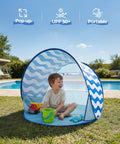 Child playing inside Pop Up Baby Beach Tent With UPF 50+ Canopy, Portable Sun Shade For Infants And Toddlers, Blue Wave Stripes