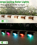 16 Pack Solar Deck Lights Outdoor Color Changing LED Waterproof Pathway Lights shown on fence, RGB glow at night.
