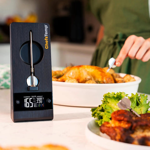 ProTemp 2 Plus Wireless Meat Thermometer With Temperature Controller next to roasted chicken and greens in kitchen