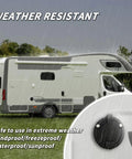Shore Power Inlet Plug With Waterproof Cover For RV And Cargo Trailer 15 Amp 125 Volt NEMA 5 15P To 5 15R Outlet Box shown installed on camper in rain.