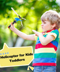 Child playing with Epic 12 Pack Handheld Flying Helicopters And Plastic Airplane Toys For Kids Outdoor Play Party Favors