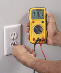 Person using Dm6410 8 Function Digital Multimeter With Large LCD Display And Data Hold for accurate AC DC voltage measurement