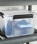 Built Like A Tank 34 Quart Gasket Storage Boxes With Lids Heavy Duty Plastic Bins for organizing clothes and gear on a shelf.