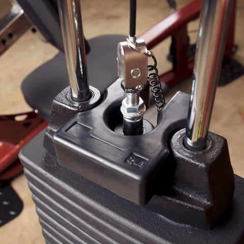 Heavy Duty 2.5 Lb Weight Stack Adapter Plate on gym machine, providing precise resistance increments for effective workouts.