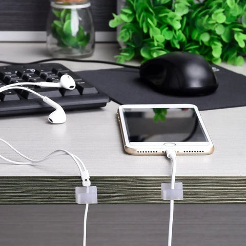 Adhesive Cable Clips 100 Pack Go To Cable Management Self Adhesive Wire Clips Cord Holders Small White For Car Outdoor Wall String Lights Desk Home Office Organization used on desk.