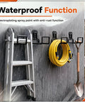 Rock Solid Heavy Duty Garage Wall Mount Hooks 8 Pack with complete screw kit holding a ladder, hose, and shovel.