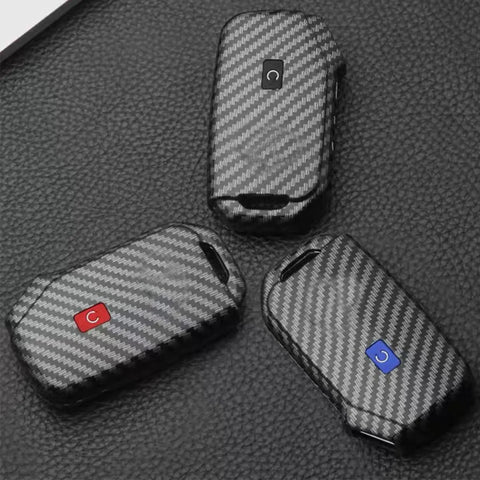 Durable Key Fob Cover For Kia Keyless Remote With Glow In The Dark Silicone Button Pad And ABS Protector Case in black on leather