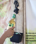 Wall Mounted Black Palm Tree Bottle Cap Opener Heavy Duty Cast Iron garage beer bottle opener in use with bottle.
