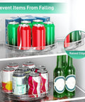 Refrigerator shelves with 9.5-Inch Lazy Susan Turntables holding cans, featuring raised edges for stable 360° spin storage.