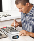 Man using Pro Grade Soldering Hot Plate With Digital Display 110V 360W Soldering Station for PCB precision heating.