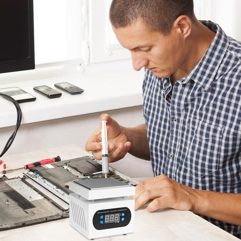 Man using Pro Grade Soldering Hot Plate With Digital Display 110V 360W Soldering Station for PCB precision heating.