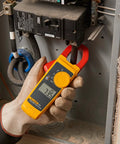 Electrician using Pro Grade Clamp Meter For Electricians With True RMS Readings, Measures AC Current To 400 A, AC And DC Voltage To 600 V