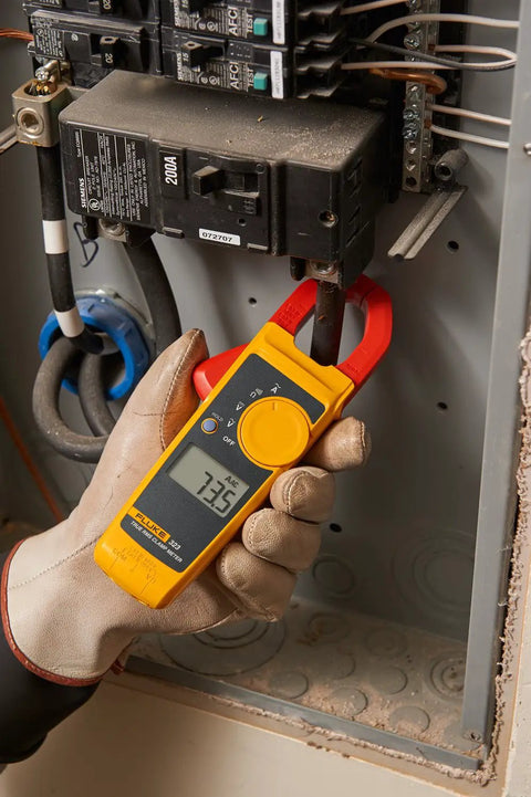 Electrician using Pro Grade Clamp Meter For Electricians With True RMS Readings, Measures AC Current To 400 A, AC And DC Voltage To 600 V