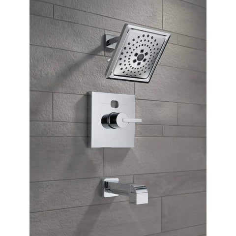 Ara Tub Spout Chrome With Pull Up Diverter, 5.5 Inch Reach, part of modern bath collection on tiled wall.