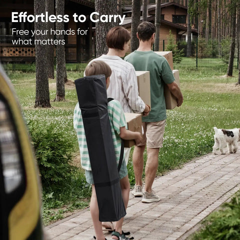 Family carrying boxes and No Fuss Easy Setup 10x10 Pop Up Canopy Tent With No Sidewalls bag on a pathway with a small dog