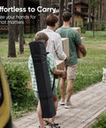 Family carrying boxes and a 10x10 Pop Up Canopy Tent Without Sidewalls, Instant Setup Gazebo For One Person in a carry bag, walking outdoors