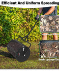 Person using Heavy Duty 24 Inch Compost Spreader For Lawn And Garden With All Iron Build, Galvanized Finish, Mega 2.7 Cu Ft Mesh Basket.