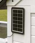 Solar panel on Sweetwater Cedar Chicken Coop For 4 To 6 Chickens With Run Nesting Box Automatic Door Roosting Bars.