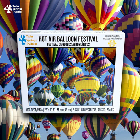 Box of Hot Air Balloon Festival 1000 Piece Jigsaw Puzzle With Easy Grip Pieces showing colorful balloons against blue sky