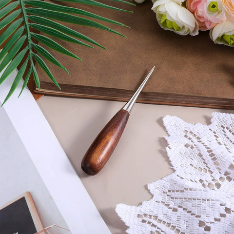 Heavy Duty Leather Working Awl, Tough As Nails Scratch Scribe For Bookbinding And Woodworking Craft Projects, Sure Grip Walnut Handle on a surface.