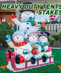 Large inflatable snowmen display secured with orange 20 Pcs 12 Inch Tent Stakes Screw In Heavy Duty Ground Anchors
