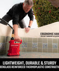Heavy Duty One Half Horsepower Submersible Water Utility Transfer Pump With 25 Foot Lay Flat Hose and Camlock Connectors for No Sweat yard drainage in use with ergonomic handle.