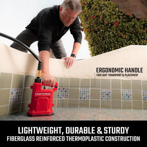Heavy Duty One Half Horsepower Submersible Water Utility Transfer Pump With 25 Foot Lay Flat Hose and Camlock Connectors for No Sweat yard drainage in use with ergonomic handle.