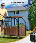 Man pushing Patio Cooler With Built In Table And Bottle Opener For Outdoor Parties, Rolling Ice Chest With Drainage