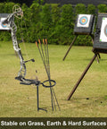 Beefy Bow Stake With 360 Degree Adjustable Rotating Fork And Arrow Ring for stable archery setup on grass with targets in view.