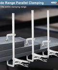Three Beefy Heavy Duty Sliding Arm Locking C Clamps securing metal pieces for welding and metalworking projects.
