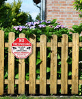 Keep Your Property Locked Tight With These Straight Up Heavy Duty No Trespassing Signs And Video Surveillance Notices Set Of Four Reflective 10 Inch Aluminum Plates With Pre Drilled Holes For No Sweat Fence Mounting. No Trespassing sign on wooden fence with flowers.