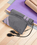 Super Cozy USB Inflatable Heated Neck Pillow With Washable Cotton Cover And Relaxing Aroma For Ultimate Work Travel Stress Relief And Healthy Posture Support on wooden floor with air pump and cotton cover.