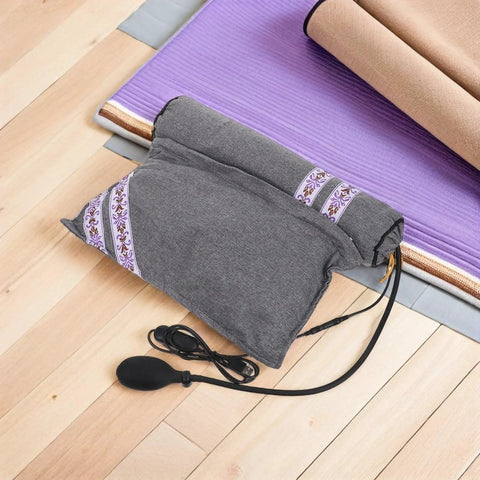Super Cozy USB Inflatable Heated Neck Pillow With Washable Cotton Cover And Relaxing Aroma For Ultimate Work Travel Stress Relief And Healthy Posture Support on wooden floor with air pump and cotton cover.