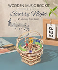 Starry Night 3D Puzzle Music Box Kit For Adults And Teens on table, showing wooden gears and colorful rotating orbs.