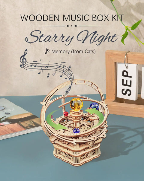 Starry Night 3D Puzzle Music Box Kit For Adults And Teens on table, showing wooden gears and colorful rotating orbs.