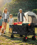 Beast Ultra Compact Folding Wagon With All-Terrain Wheels For Beach Trips Grocery Runs Camping And Gardening Heavy Duty 360 Lb Load Capacity Portable Black Cart in use at a campsite, loaded with gear, with a tent and family nearby.
