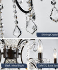 Close-up of black finish crystal candle candelabra chandelier with six light LED pendant fixture and shining crystals